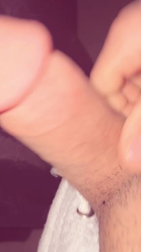 man plays with his penis