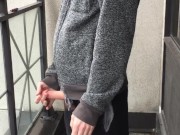 Skinny exhibitionist shows boner on public Toronto balcony while smoking