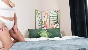 Busty blonde strips and shows off big tits and ass