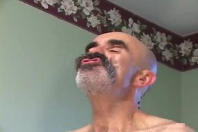 Older man bangs a tattooed dude with big ass in doggy position