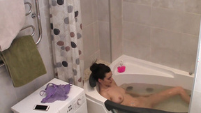 Brunette touching her titties & bald twat in the bathtub like she wants to mas