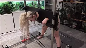 Sub slave punished in a humiliating pillory scenario