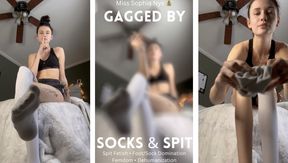 Gagged by socks and spit