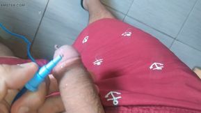 Straight boy applying the serum directly to his cock for hydration and dilation.