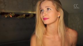 a romantic setting and a blonde spreading her legs