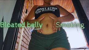 Smoking and massaging my bloated belly