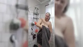 Step Mom pleasures herself in the shower