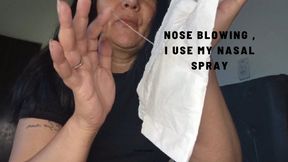 Nose blowing , I use my Nasal spray