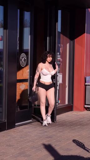 Woman in bikini walking on sidewalk
