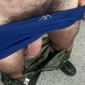 Military man in uniform in the barracks takes his huge soft hairy dick out of his pants waiting for a blowjob