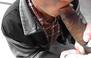 Old salesman blowing black cock in a hardware store