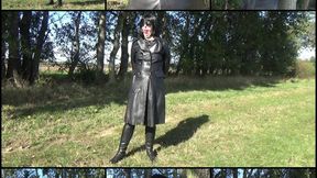 Handcuffed and ballgagged Mistress in a double-breasted leather coat