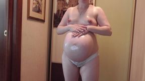 gorgeous pregnant anna massages her belly