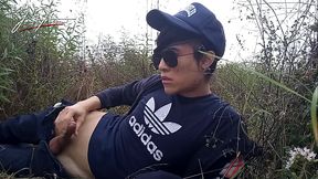 Cute gay Asian twink Jon Arteen speaks French, masturbates his smooth penis in the rain, lubricated with his saliva, moans, ejaculates sticky cum on his fingers