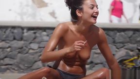 Horny Tanned Topless Babe with Pierced Nipple Filmed on Beach by