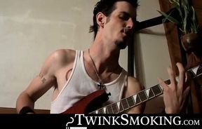 Straight rocker Axel plays his guitar and his throbbing cock with his pack of cigaret