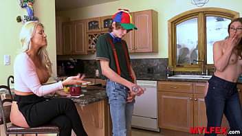 Mom and step-aunt share spoiled boy's cock in kitchen