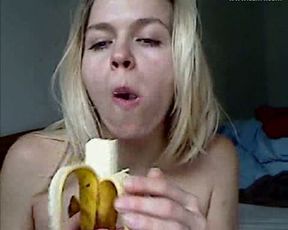 Hot blonde webcam chick temptingly eat banana topless