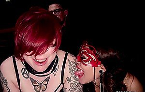 Suspended slave is fucked at bdsm party