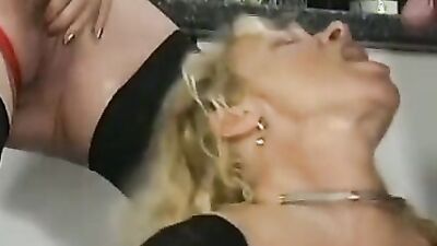 Kinky mature slut takes a piss while getting her ass drilled hard