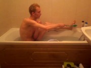 Blonde teen takes a warm bath in the bathtub