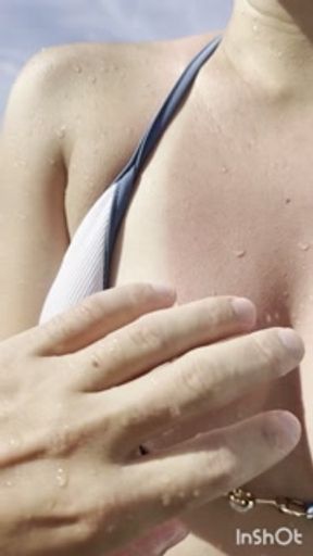 She flashes her nipples in the hotel pool