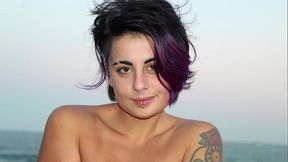 beautiful tattooed woman with colored hair