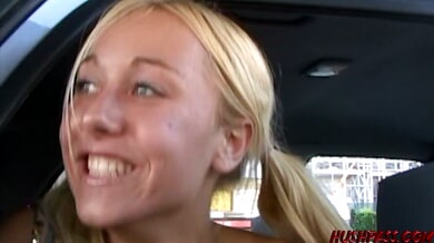 Petite blonde exhibitionist Goldie Coxx flashes her nude body on city streets and takes a cumshot to the face