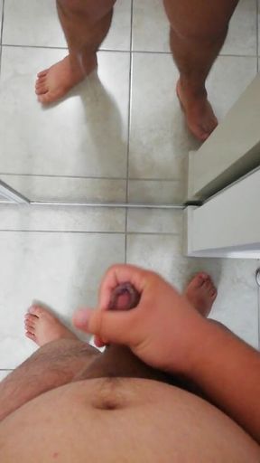 Chubby guy wanking his little cock in the mirror