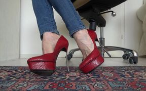 Red platform designer high heels with extreme metal heels in close-ups