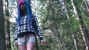 Blue haired alternative chick is ready to piss outdoors in the woods