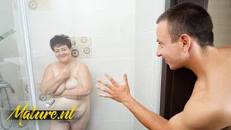 Busty hairy redhead granny enjoys hardcore sex with toyboy in the shower
