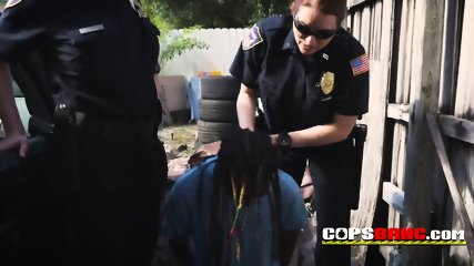 Black thug in dreads is chased and caught by busty officers