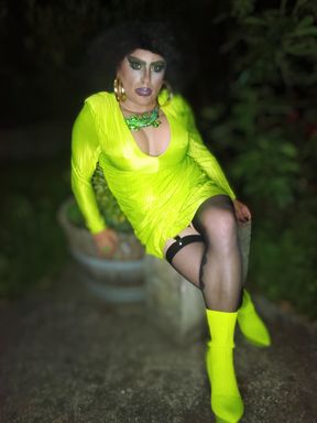 Pretty sexy mature transvestite slut shows off outdoors with a cigarette and high heels