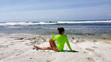 Morning yoga on a wild beach she stretched her naked legs wide with hairy pussy