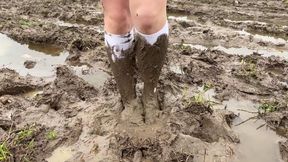 White knee socks in deep mud, muddy feet, muddy socks