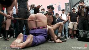 ”Big Breasted slave caned on the street”