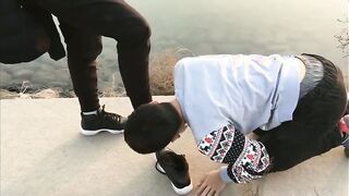 Watch this submissive Chinese amateur dominate his slave with toe sucking and shoes on!