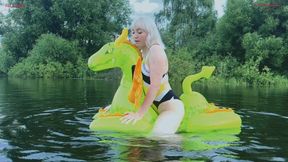 Hot fucking of a squeaky inflatable medieval dragon on a lake