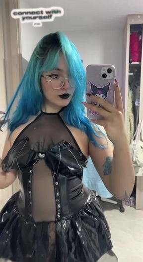 Curvy adult model displays her futuristic fashion in a standing solo