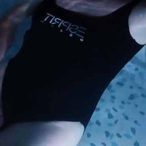 Sissy wearing Black one piece swimsuit on swimming pool