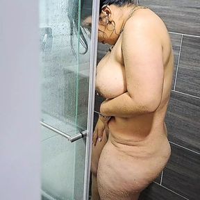 I watch my stepmom take a shower, she has a very sexy body