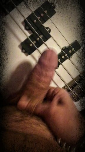 Big nice cock playing bass guitar