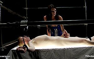 Tanned busty TS fucks bound man