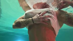 Amazon Kandy Flexes Her Massive Biceps in Her Hotel Pool