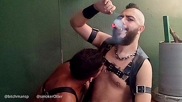 The caged bitch couldn't resist the cigar smoker's pierced cock and took his seed in the ass