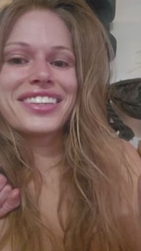 Fake boobs smokes a cigarette with French inhale