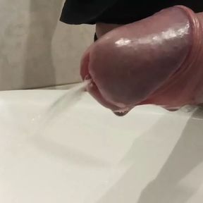 Close-up &ndash; peeing from uncut cock