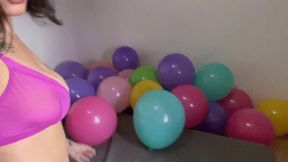 Nail popping and sit popping a lot of balloons