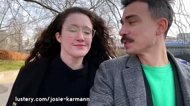 Curly-haired couple in green lingerie celebrate with passionate bedroom intimacy